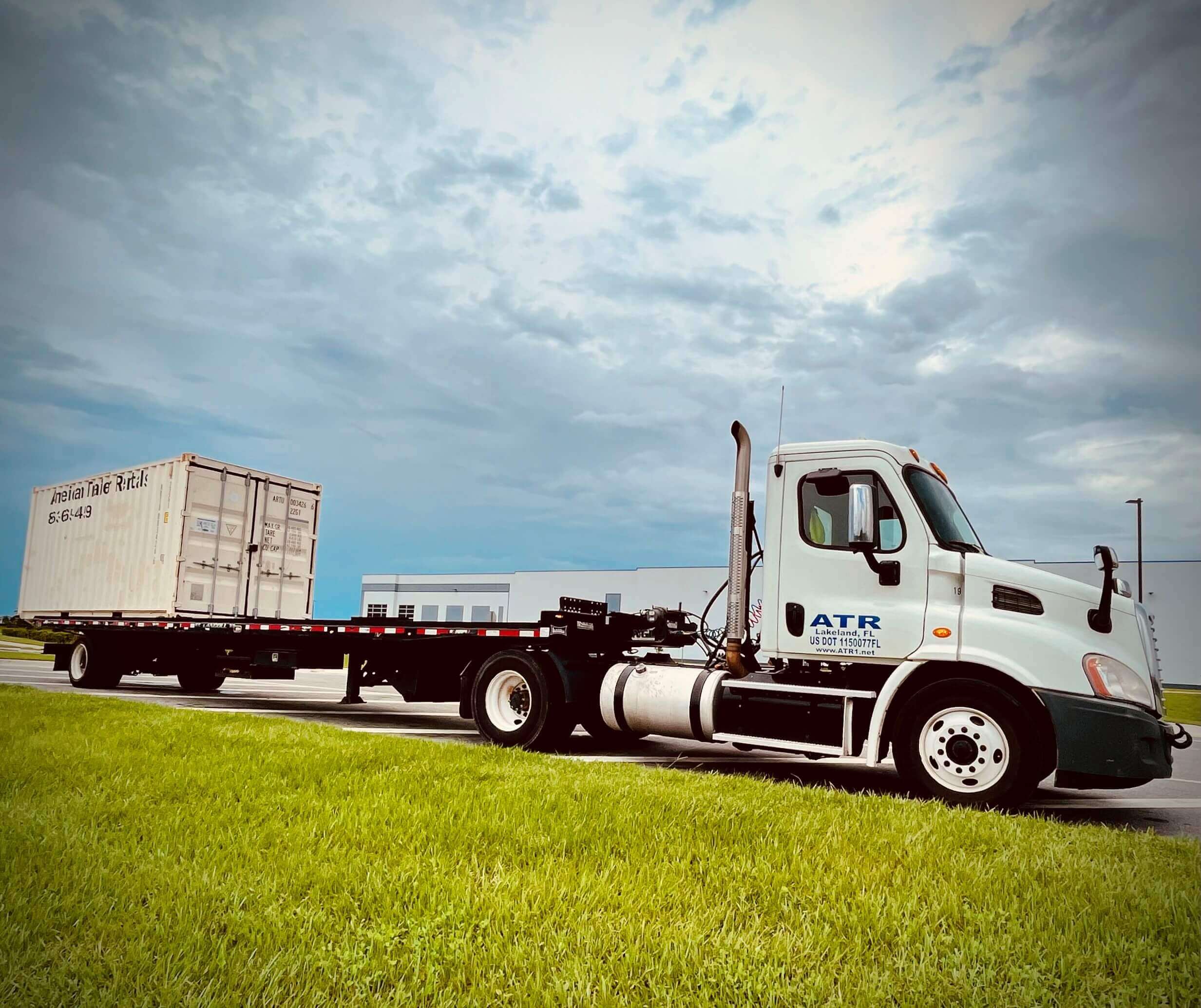 Trailer delivering a storage container